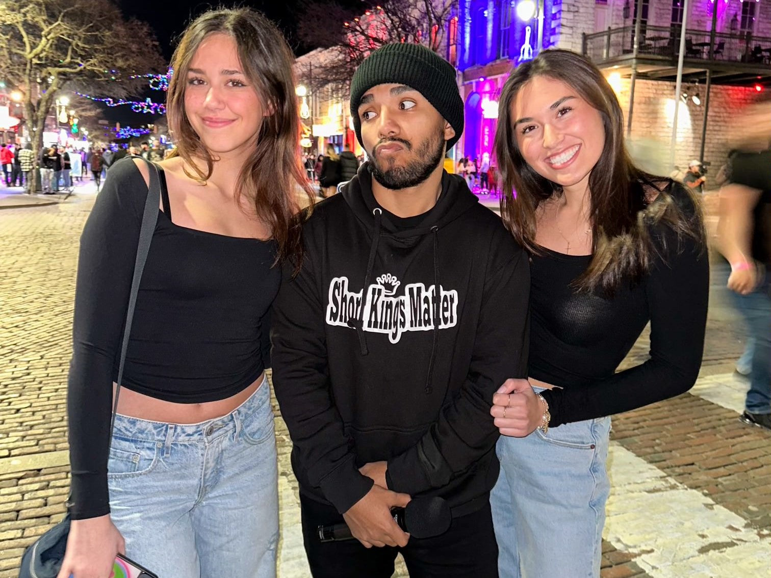 Israel Padilla chilling with 2 baddies wearing his signature Short Kings Matter hoodie